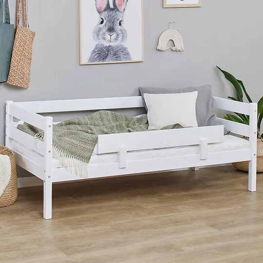 Toddler transition bed with removable guard rail