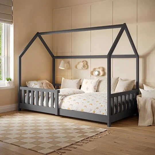 Flair Explorer house floor bed in white with side rails in a child's bedroom